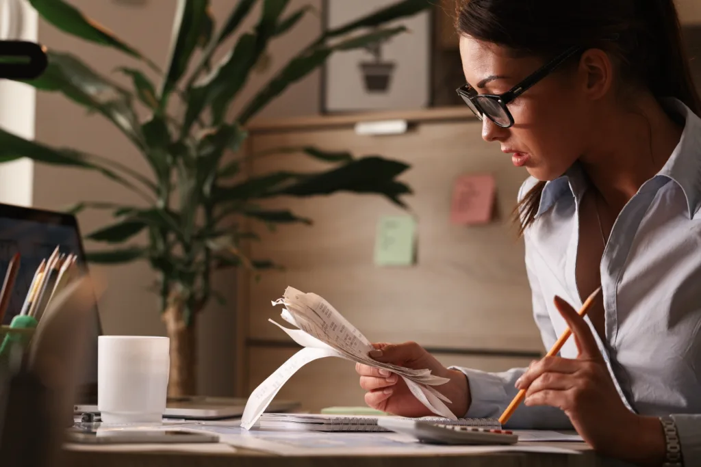 BadranTax-female accountant calculating tax bills while working finances office